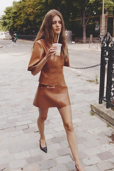 Mini jupe en tissu enduit