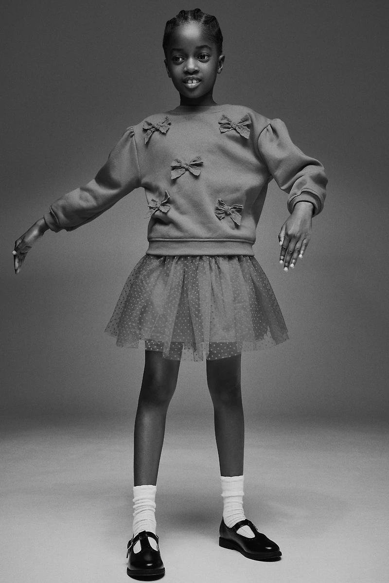 Chandail à l'intérieur brossé avec appliqués