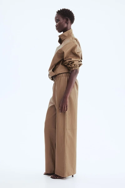 Pantalon en tissu enduit