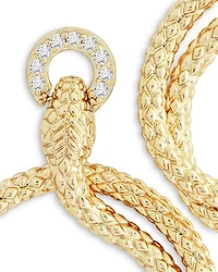 Pavé Ring Holding Serpent Drop Hoop Earrings