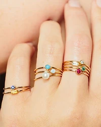 14K Gold Thin Ring with a Bezel Set Round Opal