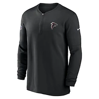 Haut Nike noir Atlanta Falcons 2023 Sideline Performance à manches longues et quart de zip pour homme