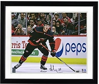 Andrei Svechnikov Carolina Hurricanes Autographed 16" x 20" Black Jersey Skating Photograph