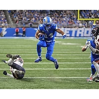 Photographie non signée d'Amon-Ra St. Brown, Lions de Détroit, touché lors du match haies la semaine 2 2025