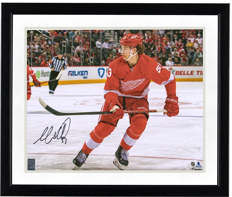 Moritz Seider Detroit Red Wings Autographed 16" x 20" Red Jersey Skating Photograph