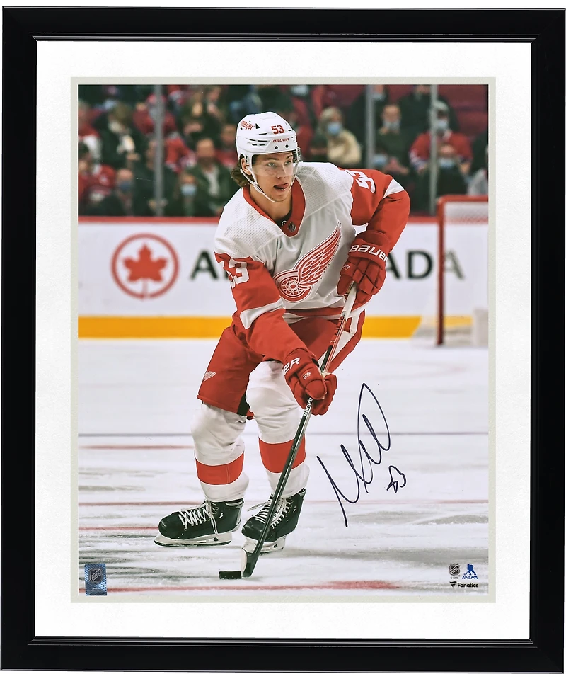 Moritz Seider Detroit Red Wings Autographed 16" x 20" Skating with Puck Photograph