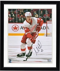Moritz Seider Detroit Red Wings Autographed 16" x 20" Skating with Puck Photograph