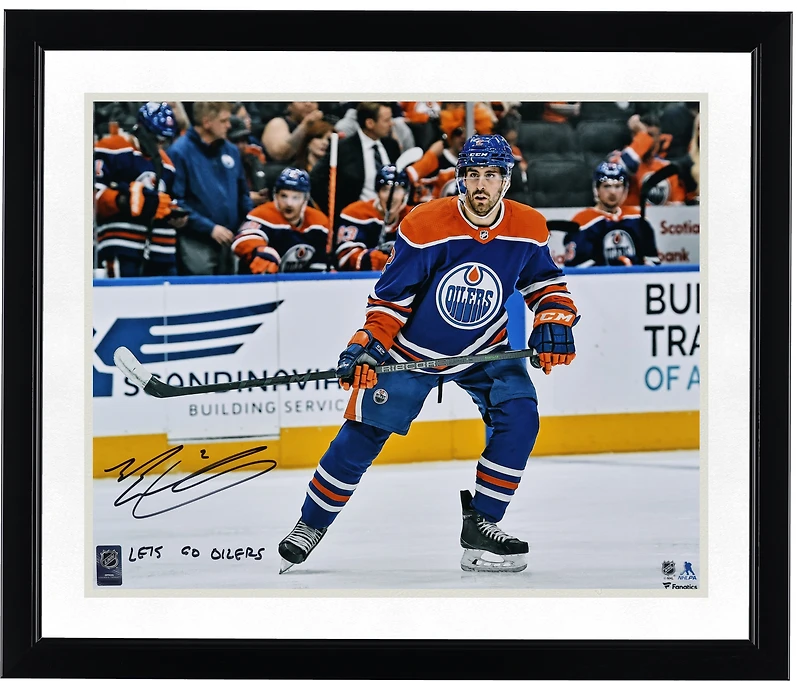 Evan Bouchard Edmonton Oilers Autographed 16" x 20" Blue Jersey Skating Photograph with "Lets Go Oilers!" Inscription