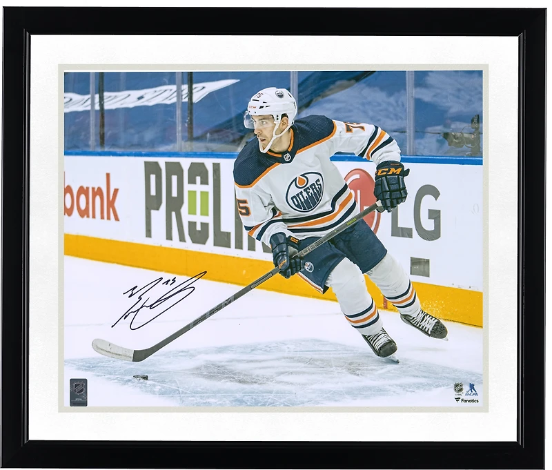 Evan Bouchard Edmonton Oilers Autographed 16'' x 20'' White Jersey with Puck Photograph