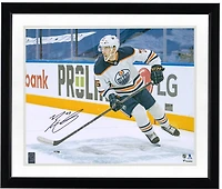 Evan Bouchard Edmonton Oilers Autographed 16'' x 20'' White Jersey with Puck Photograph