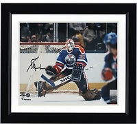 Grant Fuhr Edmonton Oilers Autographed 8" x 10" Royal Jersey Making Save Photograph