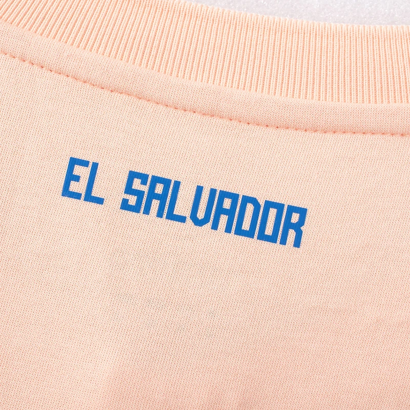 Polo à col ras du cou de l'équipe nationale Salvador Umbro Coral pour hommes