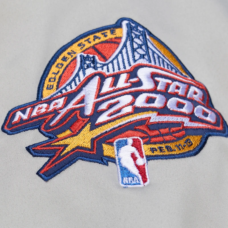 Veste Mitchell & Ness Thunderstorm légère en satin bleu/argent pour homme, modèle Golden State Warriors. Fermeture à boutons-pression.