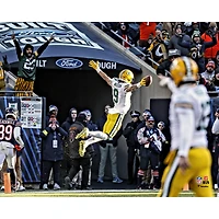 Christian Watson Green Bay Packers Unsigned Leaping for a Touchdown Photograph