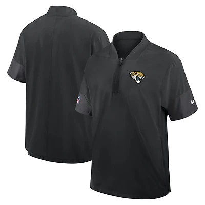 Veste d'entraîneur Nike noire Jacksonville Jaguars Sideline à manches courtes et fermeture éclair au quart pour homme, technologie Dri-FIT