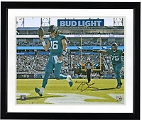 Photo dédicacée de Trevor Lawrence, joueur des Jaguars de Jacksonville, sur son maillot turquoise (40 x 50 cm) lors d'un touchdown.