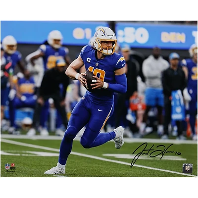 Justin Herbert Los Angeles Chargers Autographed 16" x 20" Royal Jersey Scrambling Photograph