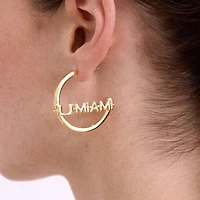 Boucles d'oreilles créoles BaubleBar avec logo des Hurricanes de Miami