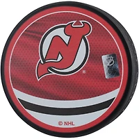 Rondelle de hockey rétro inversée autographiée par Akira Schmid des Devils du New Jersey 2022-23