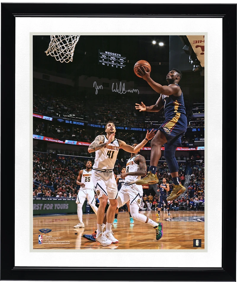 Zion Williamson New Orleans Pelicans Autographed 16" x 20" Navy Jersey Layup Vertical Photograph
