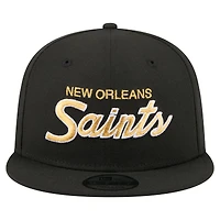 Casquette snapback New Era 9FIFTY noire pour homme, logo New Orleans Saints Core Team.