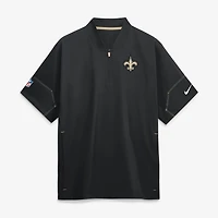 Veste d'entraîneur Nike noire pour homme, manches courtes, fermeture éclair au quart, New Orleans Saints Sideline.