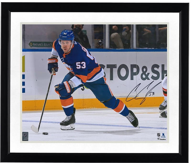 Casey Cizikas New York Islanders Autographed 16" x 20" Blue Jersey Skating with Puck Photograph