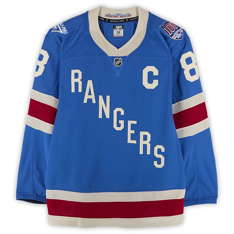 Maillot bleu du centenaire n° 8 des Rangers de New York porté par J.T. Miller lors du match contre les Hurricanes de la Caroline le 5 février 2026