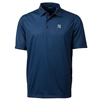 Polo stretch Cutter & Buck bleu marine à pois doubles, motif brochet, pour homme.