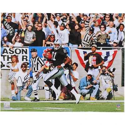 Photo dédicacée de Tim Brown, joueur des Raiders d'Oakland, en train de courir le long de la ligne de touche (40 x 50 cm).