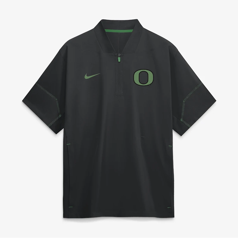 Veste d'entraîneur Nike noire pour homme, collection Oregon Ducks 2026, manches courtes et fermeture éclair au quart.