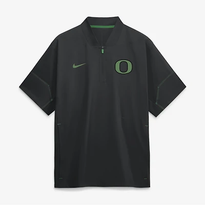 Veste d'entraîneur Nike noire pour homme, collection Oregon Ducks 2026, manches courtes et fermeture éclair au quart.