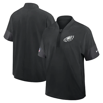 Veste d'entraîneur Nike Philadelphia Eagles Sideline noire pour homme, manches courtes, fermeture éclair au quart, technologie Dri-FIT