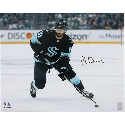 Matty Beniers Seattle Kraken Autographed 16" x 20" Navy Jersey with Puck Photograph