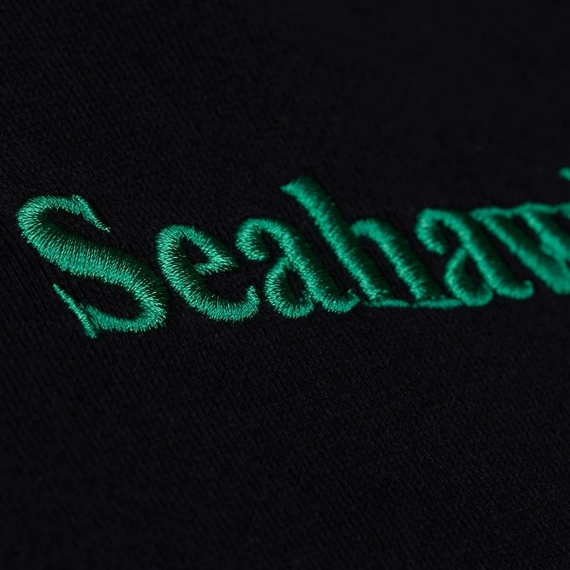 Polo de rugby court à manches longues Mitchell & Ness noir Seattle Seahawks pour femme