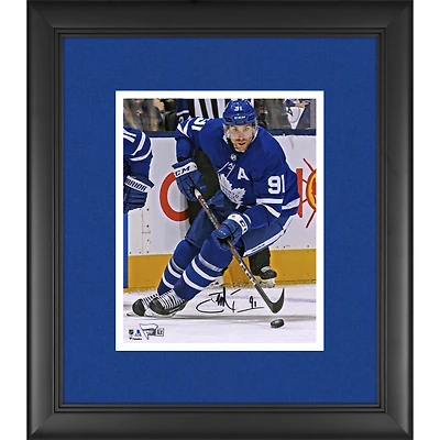 John Tavares Toronto Maple Leafs Framed Autographed 8" x 10" Blue Jersey Skating with Puck Photograph