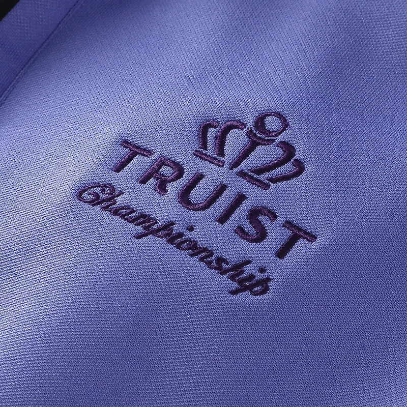 Gilet FootJoy violet Truist Championship pour homme, en piqué brossé à col zippé.