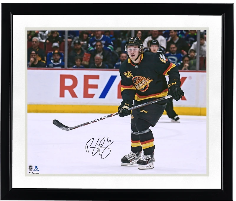 Brock Boeser Vancouver Canucks Autographed 16" x 20" Black Jersey Skating Photograph