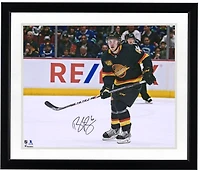 Brock Boeser Vancouver Canucks Autographed 16" x 20" Black Jersey Skating Photograph