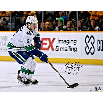 Brock Boeser Vancouver Canucks Autographed 16" x 20" White Jersey Skating with Puck Photograph