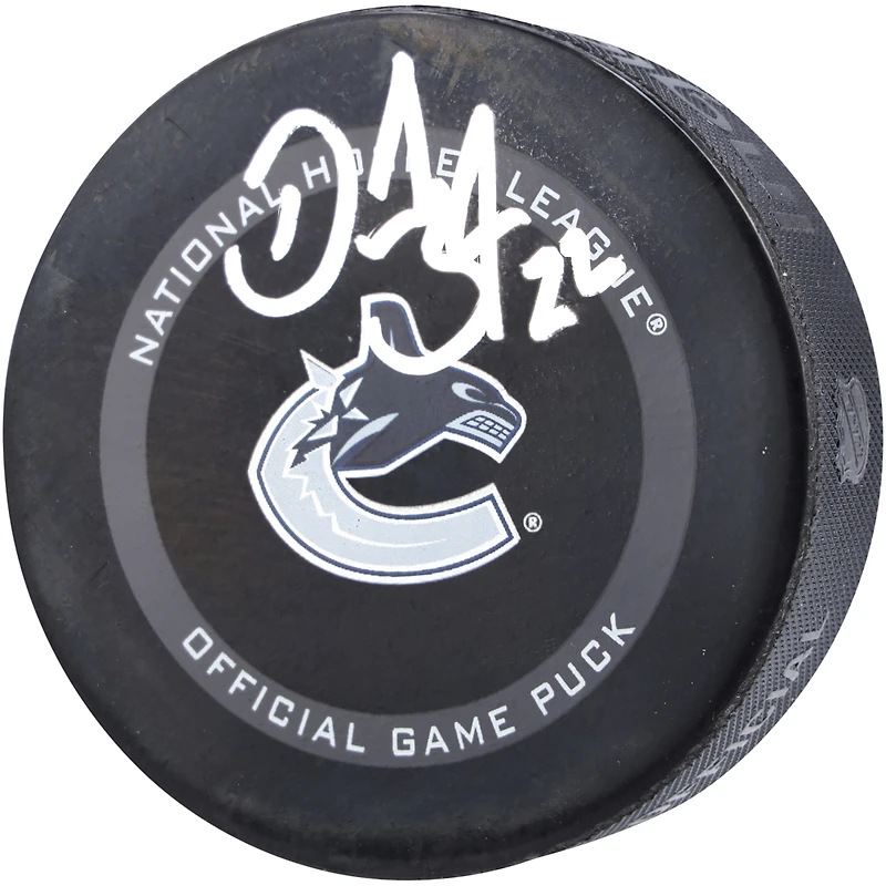 Rondelle de match officielle de la LNH autographiée par Daniel Sedin des Canucks de Vancouver