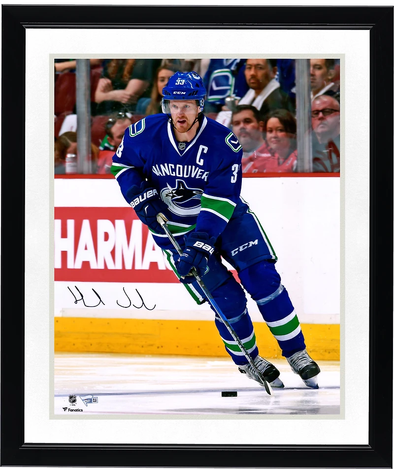 Henrik Sedin Vancouver Canucks Autographed 16" x 20" Blue Jersey Skating Photograph