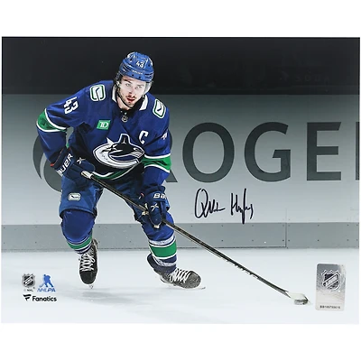 Quinn Hughes Vancouver Canucks Autographed 8" x 10" Blue Jersey Spotlight Photograph 