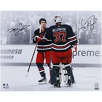 Connor Hellebuyck & Mark Scheifele Winnipeg Jets Autographed 16" x 20" Navy Alternate Jersey Celebration Spotlight Photograph
