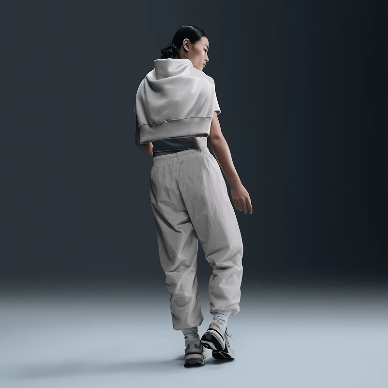 Nike Pantalon d'entraînement tissé à taille moyenne Essential - Pour femmes