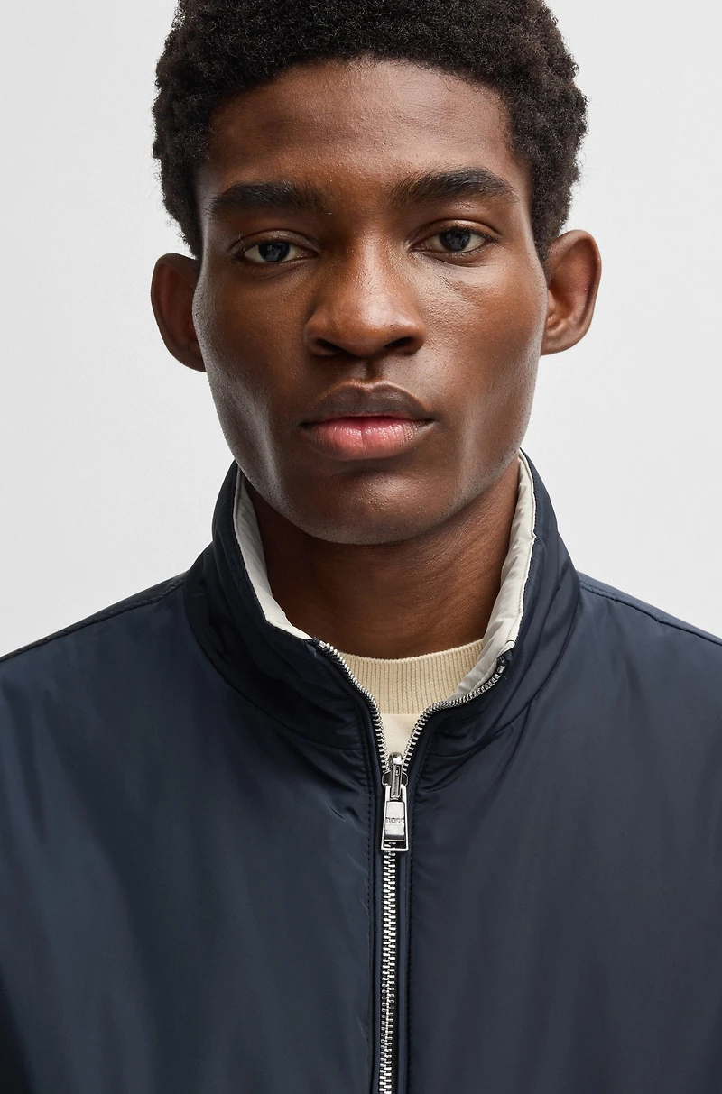 Water-repellent reversible jacket with logo badge
