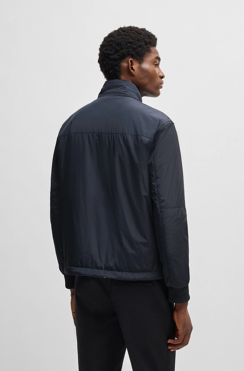 Water-repellent reversible jacket with logo badge