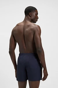 Swim shorts with signature stripe and logo