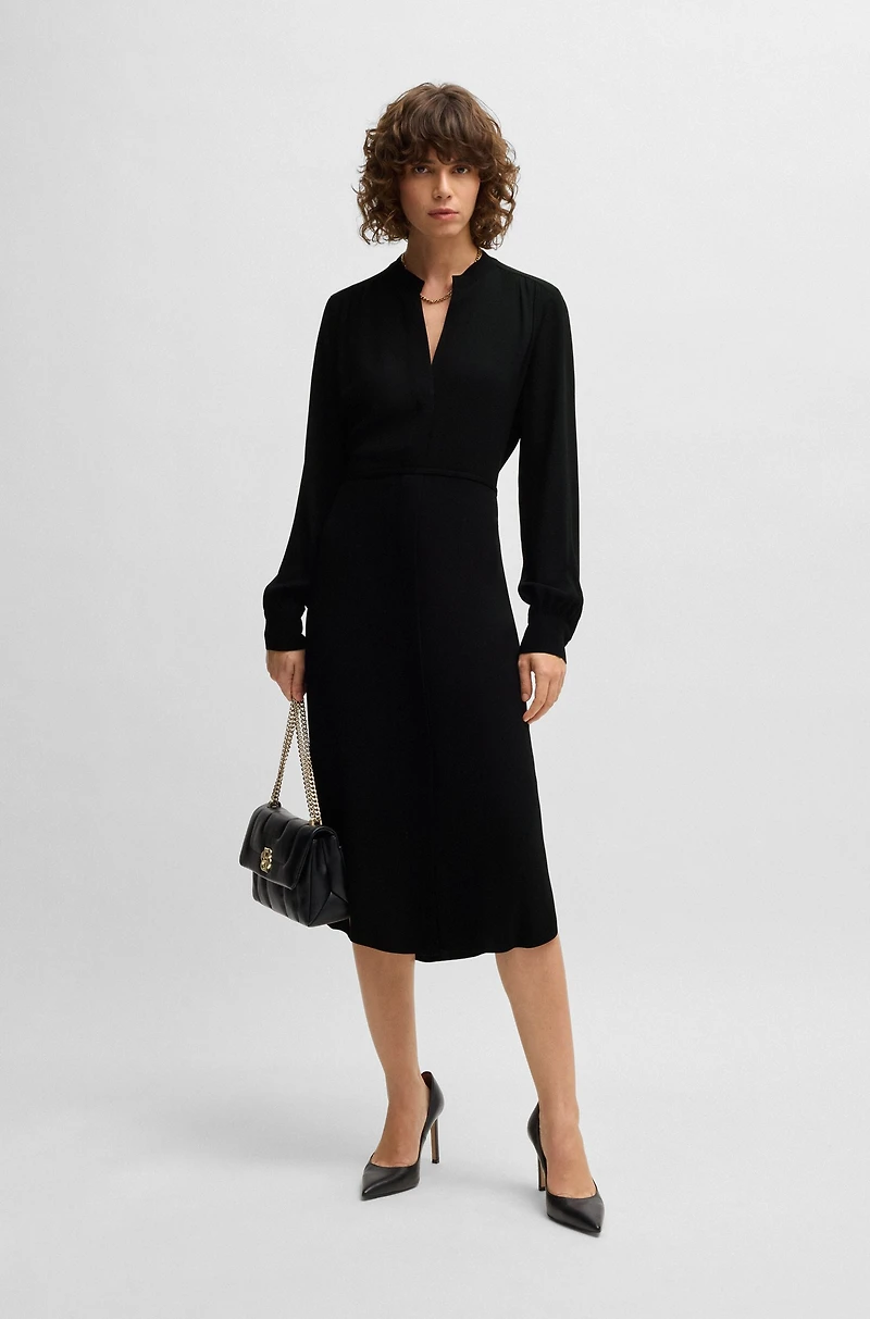 Belted dress with collarless V neckline and button cuffs