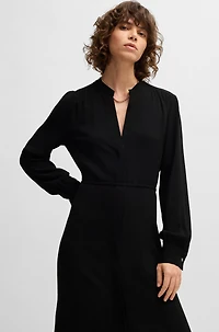 Belted dress with collarless V neckline and button cuffs